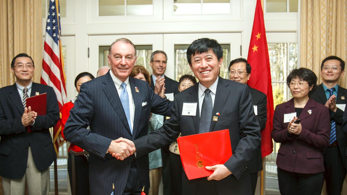 U.S - China - Home Page - Hero - China signing handshake - 1160x652